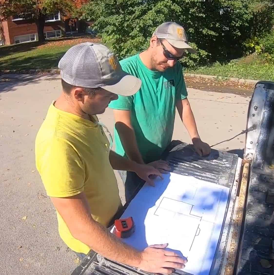 Interlock repair specialist discussing a project with a homeowner